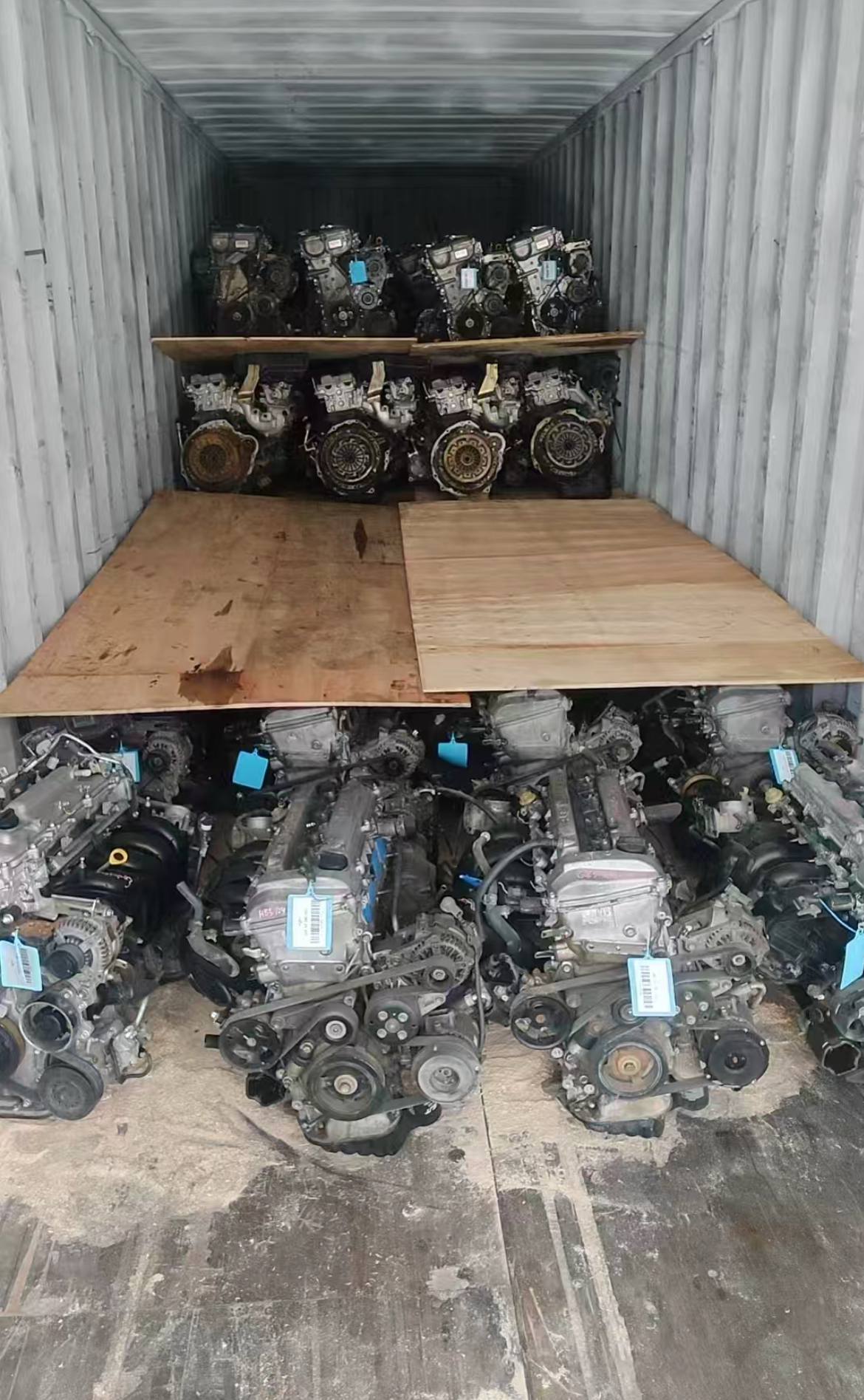 Used engines arranged inside a shipping container