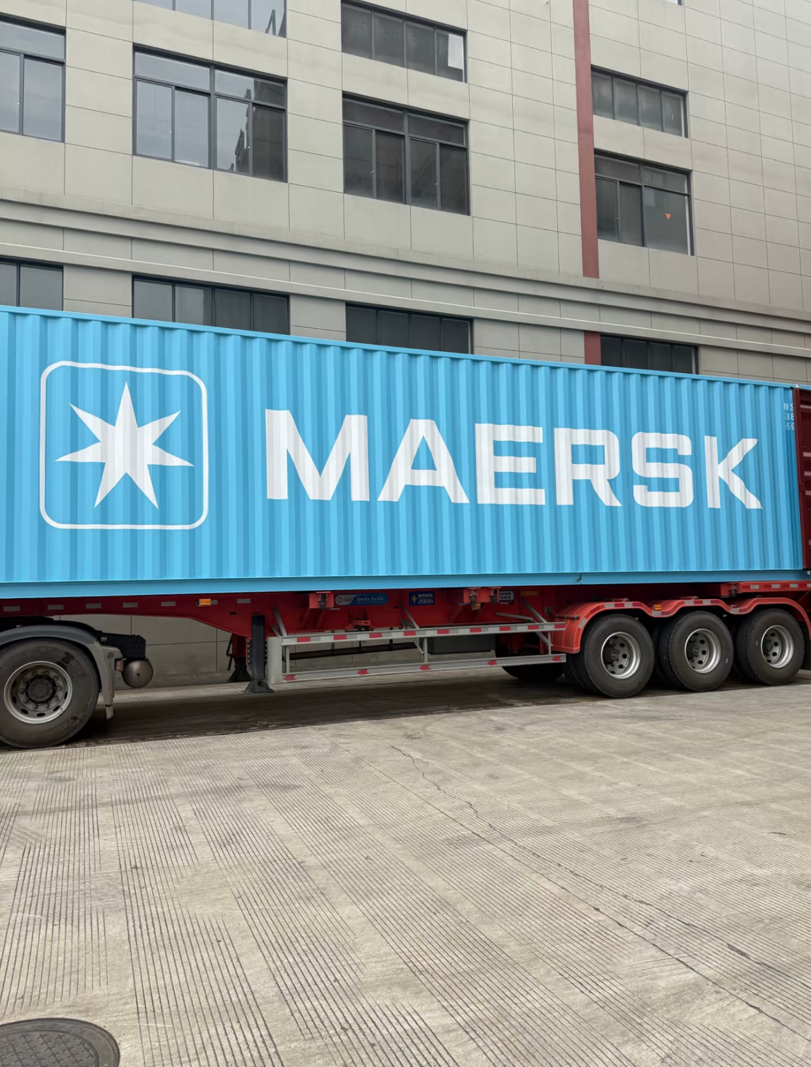 Shipping container on a truck at a commercial loading area